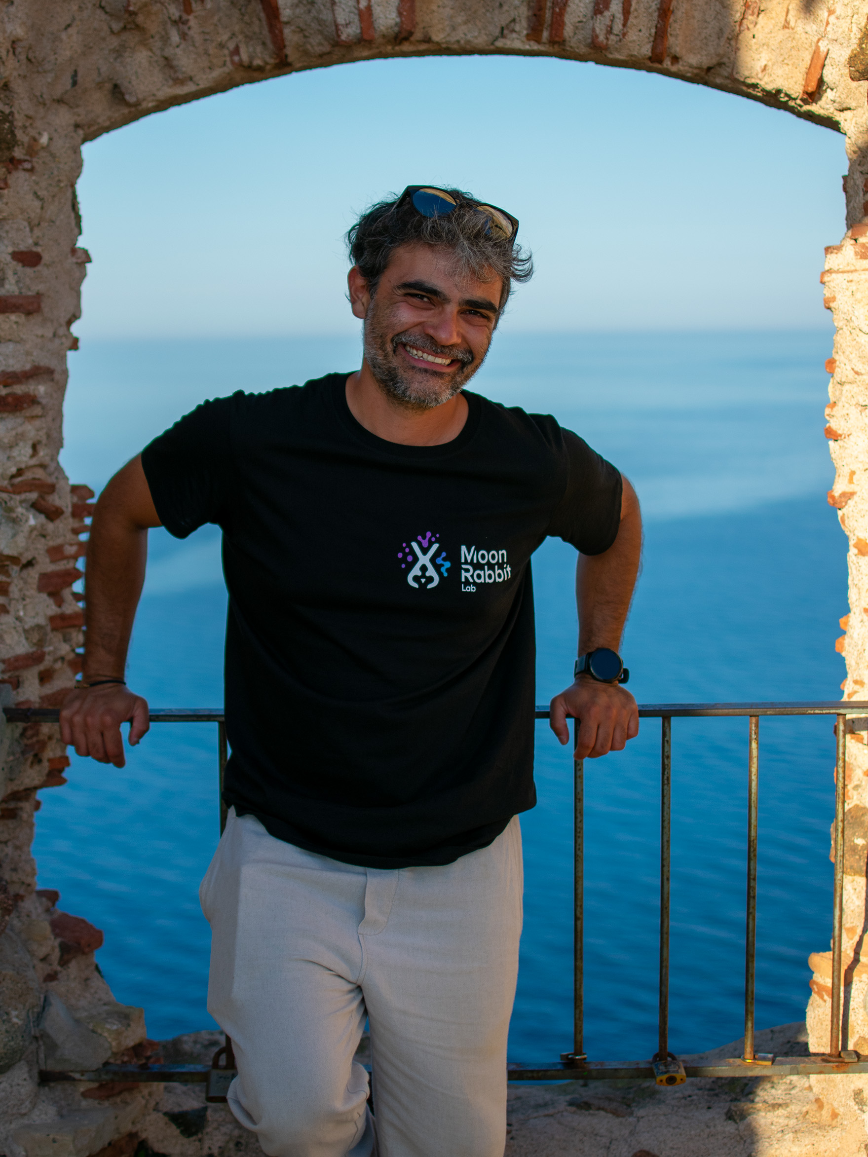 Jesus Marini Parissi wearing a Moon Rabbit Lab shirt beside the sea